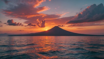 Fototapeta premium Volcanic Sunset Over Tranquil Ocean View with Dramatic Clouds and Serene Waters Perfect for Vacation and Nature Enthusiasts
