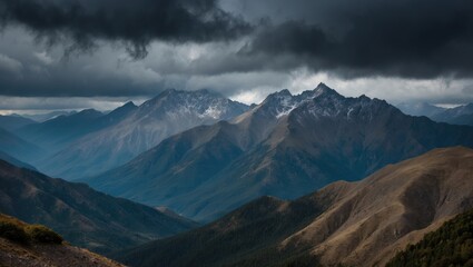 Fototapeta premium Majestic Mountain Range Under Dramatic Dark Clouds Evoking Nature's Power and Serene Beauty