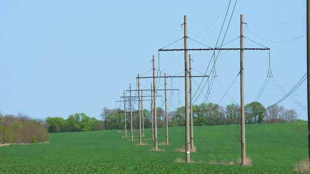 High voltage transformer against the blue sky. Electric current redistribution substation