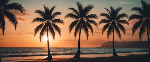 Fototapeta premium Silhouette of palm trees at sunset over the ocean creating a serene beach atmosphere with an empty space for text or graphics.