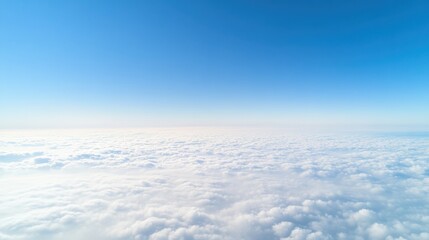 A serene view of a vast sky filled with soft, fluffy clouds against a bright blue background.