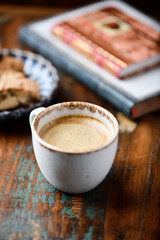 Cup of coffee on wooden background. Soft focus.	