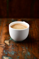 Cup of coffee on wooden background. Soft focus. Copy space.	