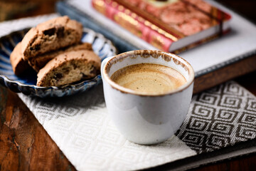 Cup of coffee and Cantuccini (Italian cookie) on dark wooden background. Copy space.	