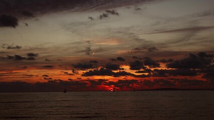 sunset at sea ships against the backdrop of the setting sun