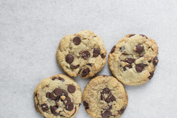 Overhead view of chocolate chip cookies, top view of homemade chocolate chip cookies on a white background