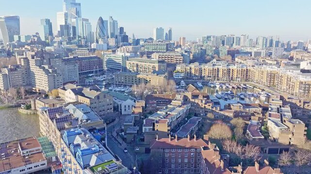 Aerial drone shot showing a cityscape of London; with Londons Business district in the distance and urban housing in the foreground. London, United Kingdom