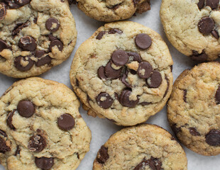 Overhead view of chocolate chip cookies, top view of homemade chocolate chip cookies on a white background