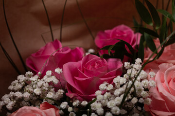 Beautiful pink roses and baby's breath in a bouquet. Perfect for Valentine's Day, Mother's Day, or...