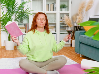 woman doing yoga and stretching exercises in her home. sport at home.