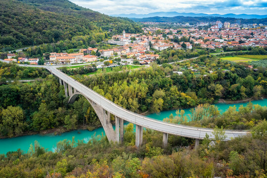 Aerial view of a big arch bridge over the Soca River and Nova Gorica town in western Slovenia.
