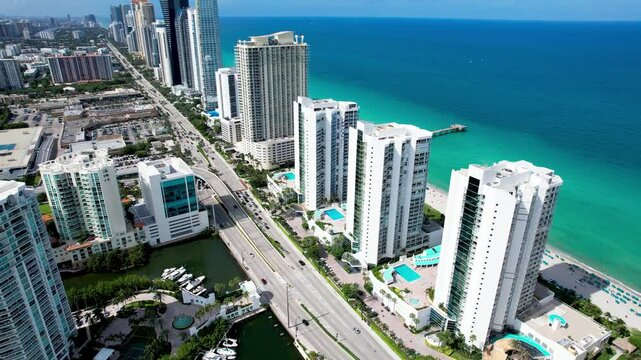 Sunny Isles Beach, Florida - July 13, 2024: Rows of waterfront condos along Collins Avenue forming the Sunny Isles skyline.