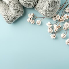 background for product mockup flat lay anthropology aesthetic lighting blue ,Elegant Blue-Toned Flat Lay Background for Product Mockups Soft yarn and delicate flowers on blue background