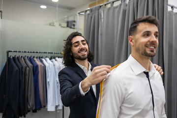 Tailor Adjusting Suit for Client in a Suit Store