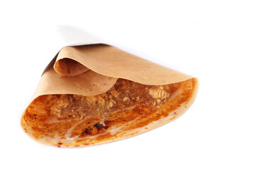 Crispy homemade Japanese crepes in wrapping paper, isolated on white background. Concept, traditional snack in Thailand, street food, tasty dessert            