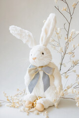 Obraz premium A high-fashion modern Easter Bunny, designed with elegant calligraphy-inspired lines and luxurious Peach Fuzz, chambray blue, and gold color accents.