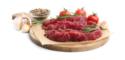 Pieces of raw beef meat, spices and tomatoes isolated on white