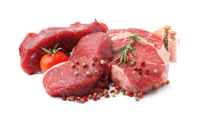 Pieces of raw beef meat, spices and tomato isolated on white