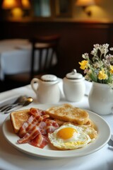Enjoying crispy bacon, sunny side up eggs and toast in a cozy morning setting