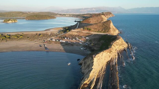 Panoramic view of Zvernec beach or Dalan beach near Vlore with parked campervans or motorhomes. Amazing landscape of Adriatic sea - Albania, Europe.