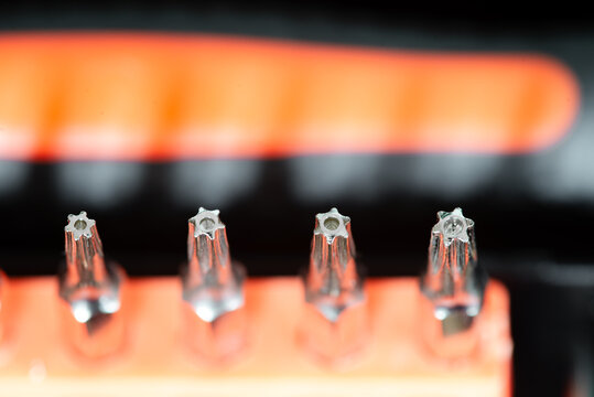 Detail of torx security magnetic precision screwdriver bits on white background