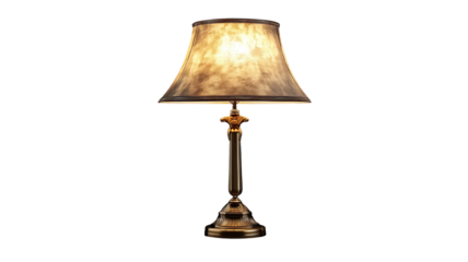 A vintage-inspired table lamp with an ornate brass base and an elegant fabric lampshade in a warm beige color, isolated on a transparent background. 