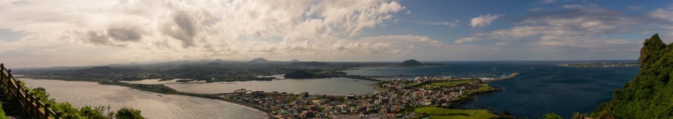 Panoramic Coastal Landscape with City, Harbor, Rolling Hills, and Vast Ocean from Hallasan Mountain Overlook