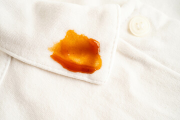 Dirty tomato sauce stain removal or ketchup on cloth accident to wash with washing powder, cleaning housework.