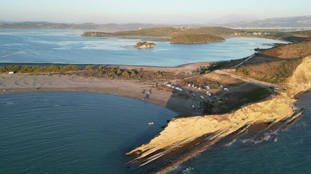 Panoramic view of Zvernec beach or Dalan beach near Vlore with parked campervans or motorhomes. Amazing landscape of Adriatic sea - Albania, Europe.