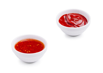 Two small bowls of sauces on a white background ready for dipping