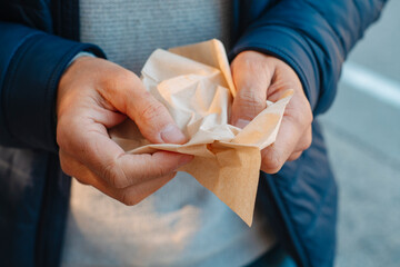 man with a recycled paper tissue on his hands