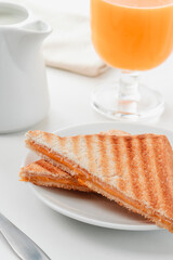 freshly grilled sandwich and natural orange juice