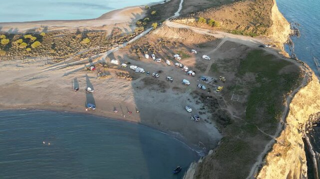 Panoramic view of Zvernec beach or Dalan beach near Vlore with parked campervans or motorhomes. Amazing landscape of Adriatic sea - Albania, Europe.