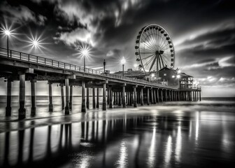 Obraz premium Black and White Santa Monica Pier Pylons at Night - Low Light Photography Stock Photo