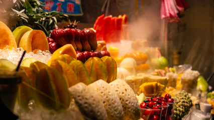 Vibrant Assortment of Fresh Tropical Fruits Displayed on Ice Creating Colorful Scene at Taipei Night Market