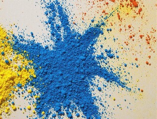 Obraz premium A blue and yellow powder is spread out on a white surface
