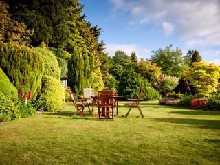 English Garden with wooden funrniture