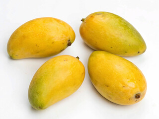 Close-up studio shot of mangoes, showcasing their smooth skin, juicy flesh, and appealing colors