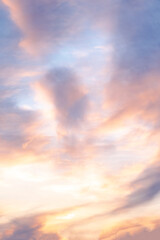Majestic Sunset Clouds. A Perfect Blend of Golden, Lilac, and Pink in the Expansive Blue Sky