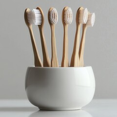 A set of bamboo toothbrushes in a ceramic holder, eco-friendly, photorealistic, white background