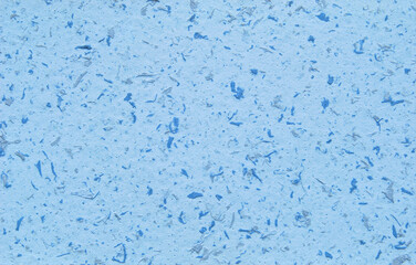 Light blue decorative flakes wall texture or pattern as background