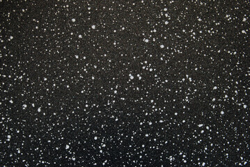 Black spotted texture, black ceramic chips texture as background