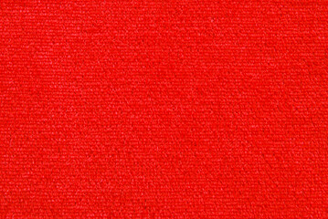 Soft red color velour fabric texture as background	