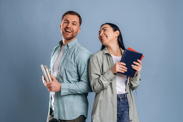 Education concept, ready for university. Man and woman are in the studio