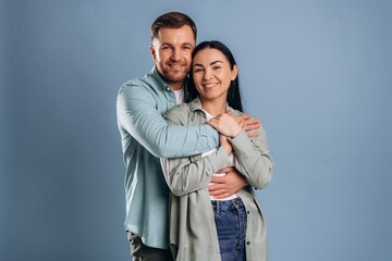 Cute couple having fun. Man and woman are in the studio