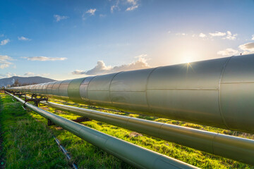 Geothermal energy. Pipelines of a plant at sunset in Larderello, Tuscany region, Italy
