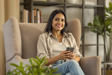 Obraz premium Portrait of a Confident Indian Businesswoman in a Modern Setting