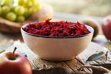 Red beetrood salad in a white bowl