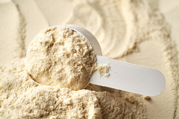 Whey protein powder in a measuring cup
