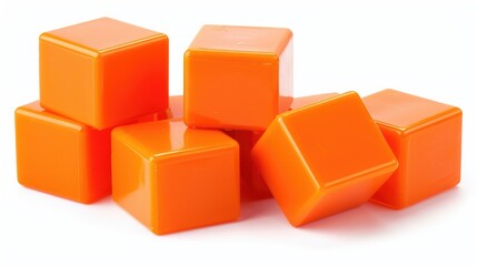 Fototapeta premium A vibrant arrangement of orange building blocks stacked creatively on a white background, ideal for educational purposes